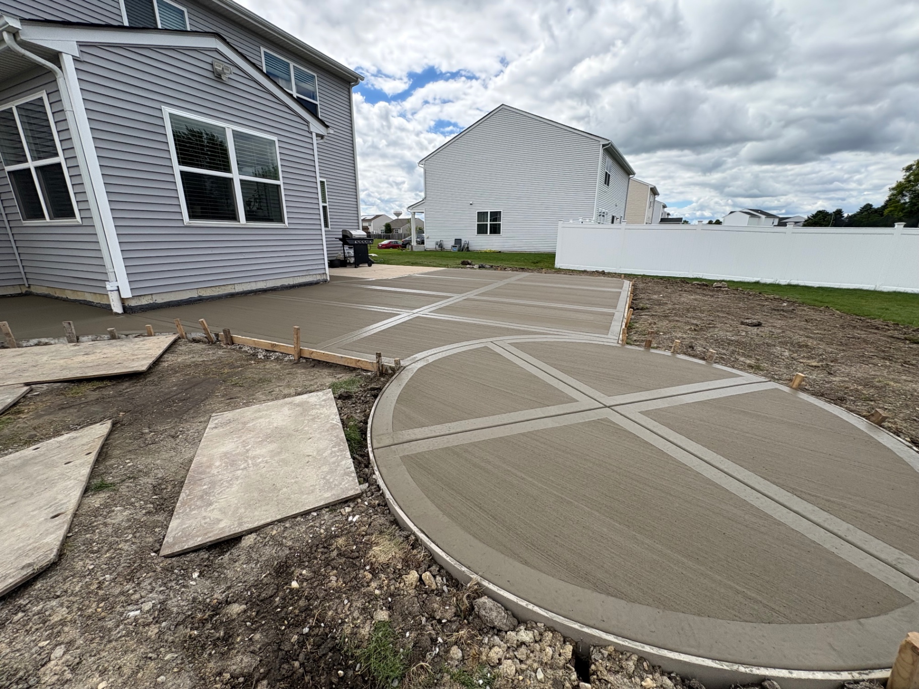 Decorative circular concrete patio and driveway