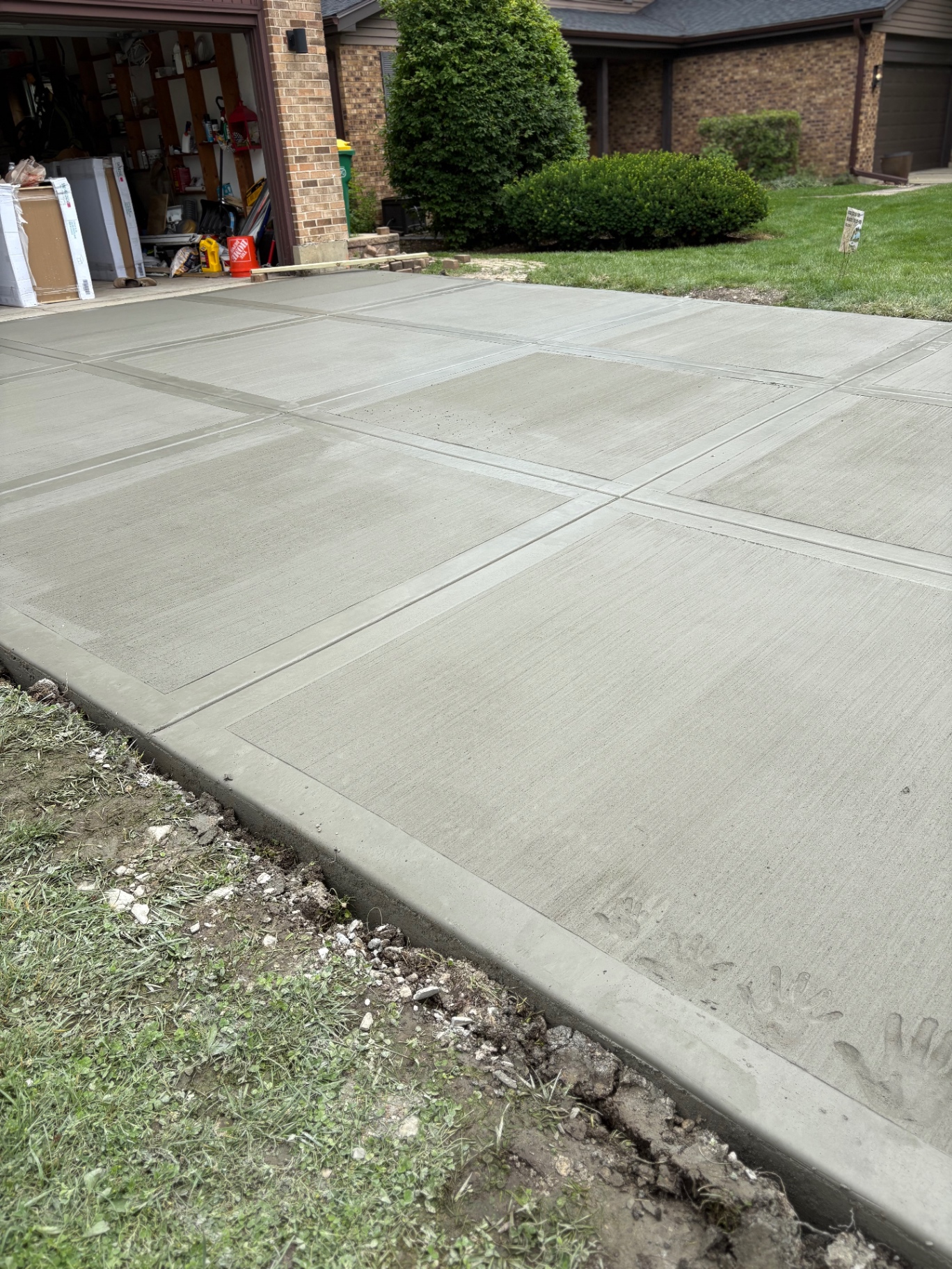 Brushed concrete driveway with ribbon detail
