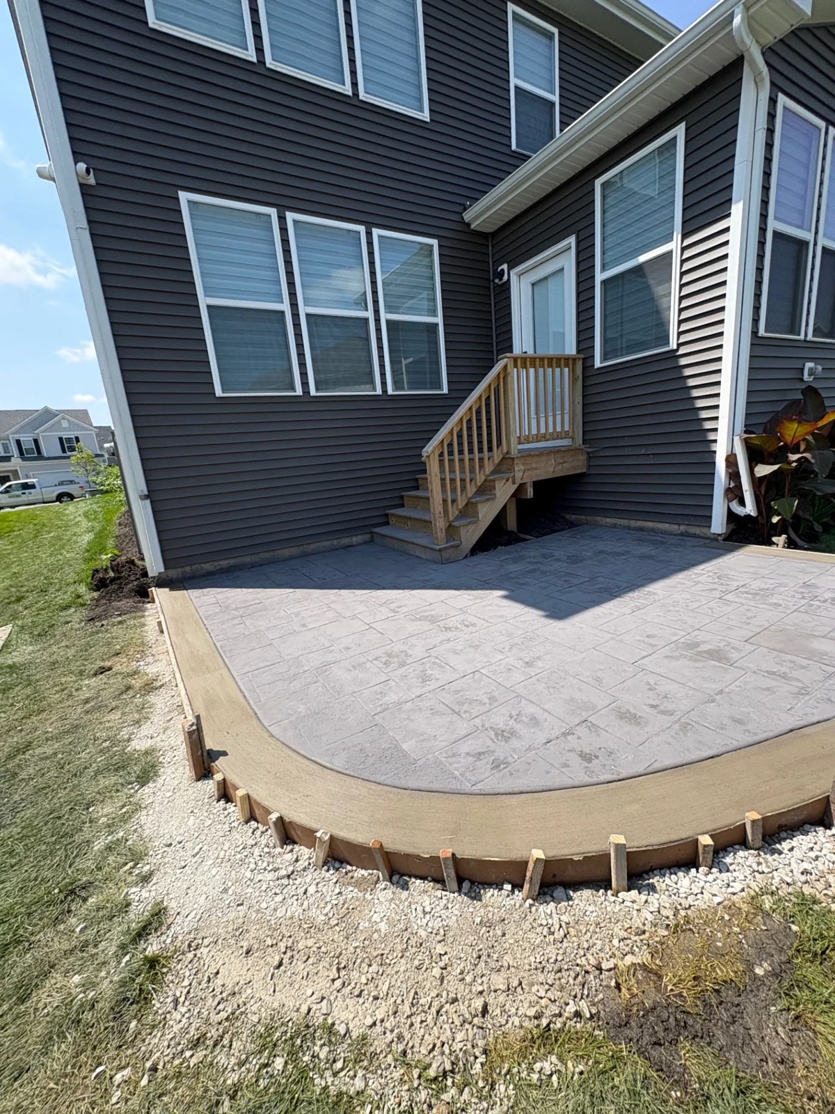 Stamped concrete patio with curved border in Illinois