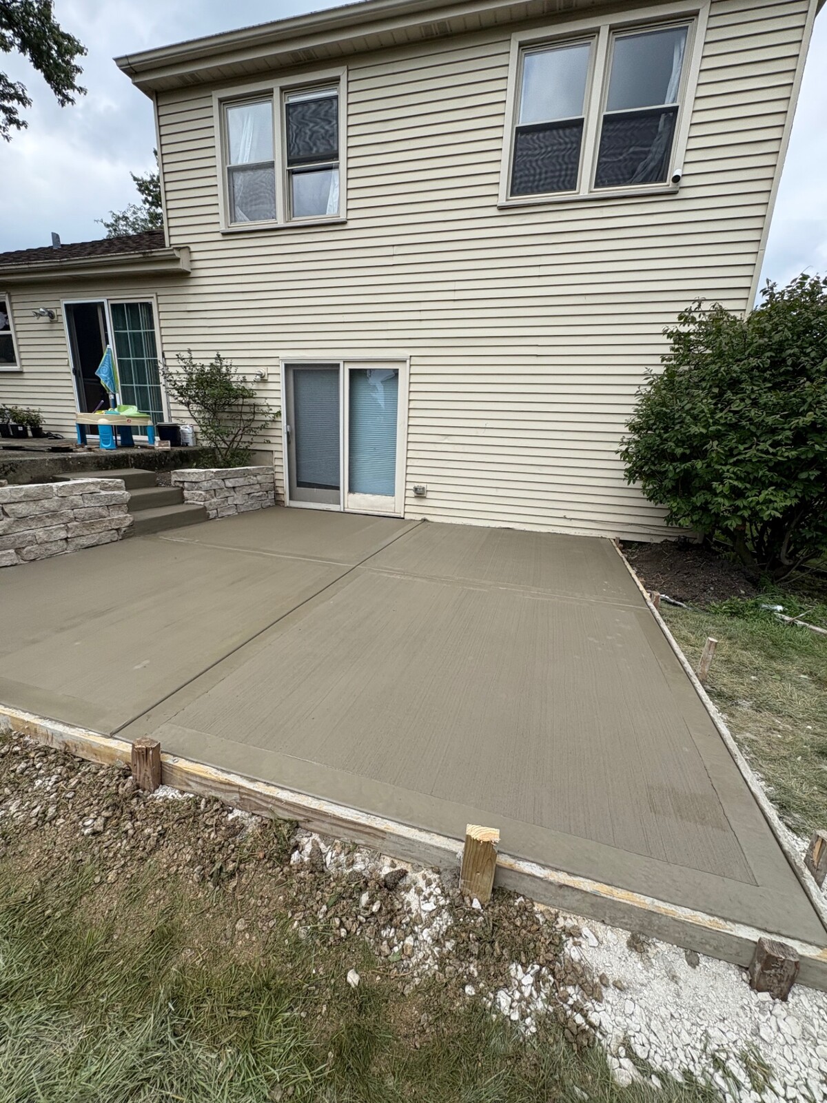 Freshly poured backyard concrete patio