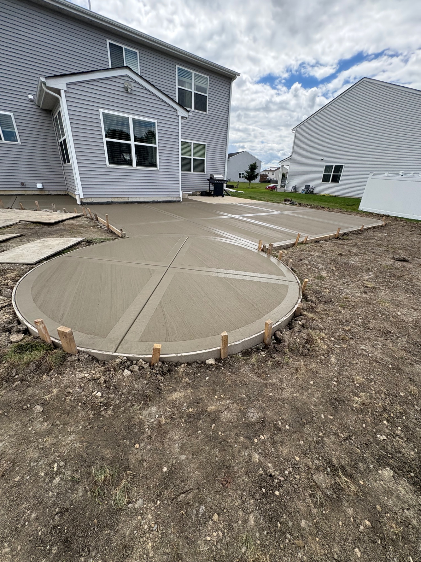 Finished circular concrete patio and driveway